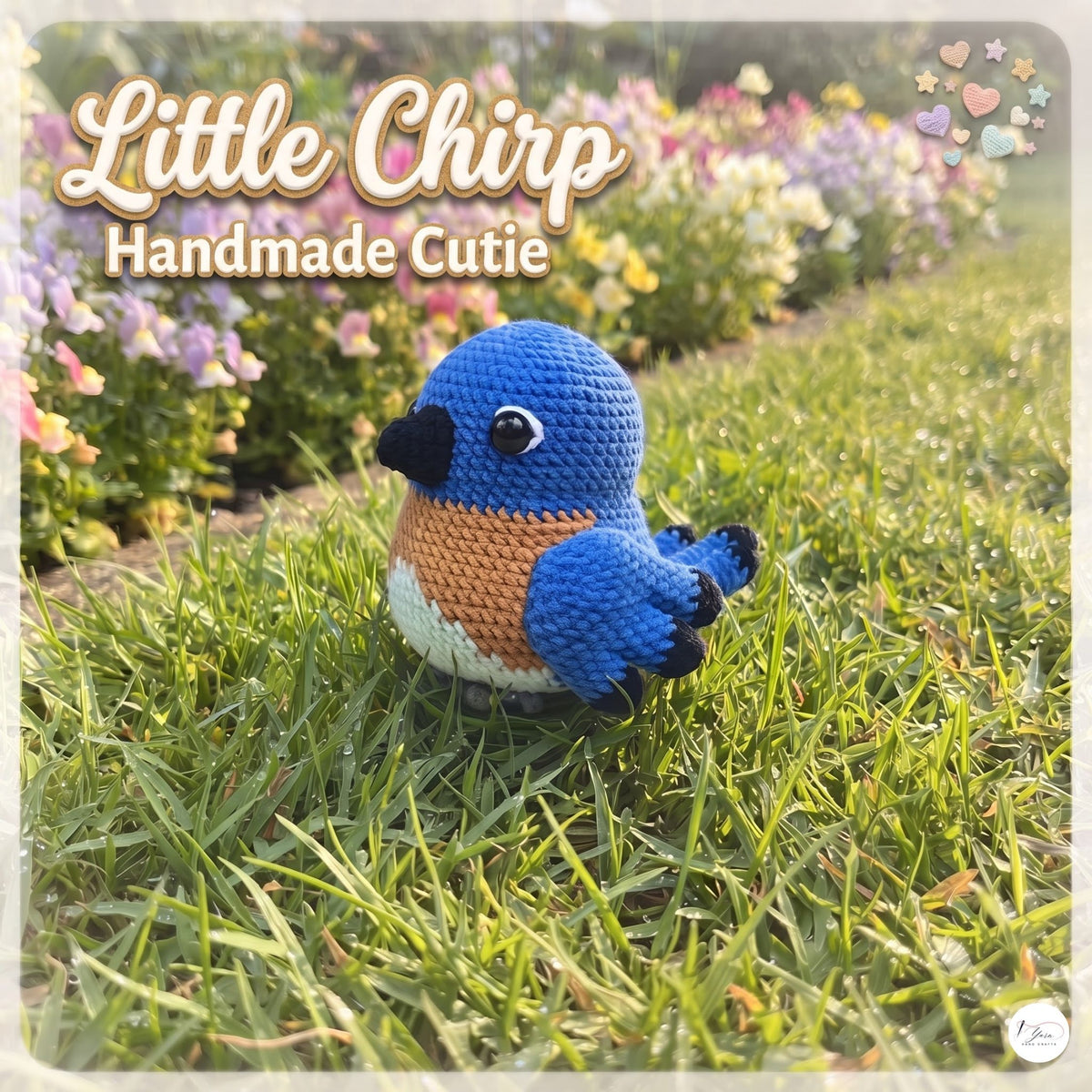 A crocheted blue bird toy labeled 'Little Chirp Handmade Cutie' sits on green grass in a sunny garden with flowers in the background.