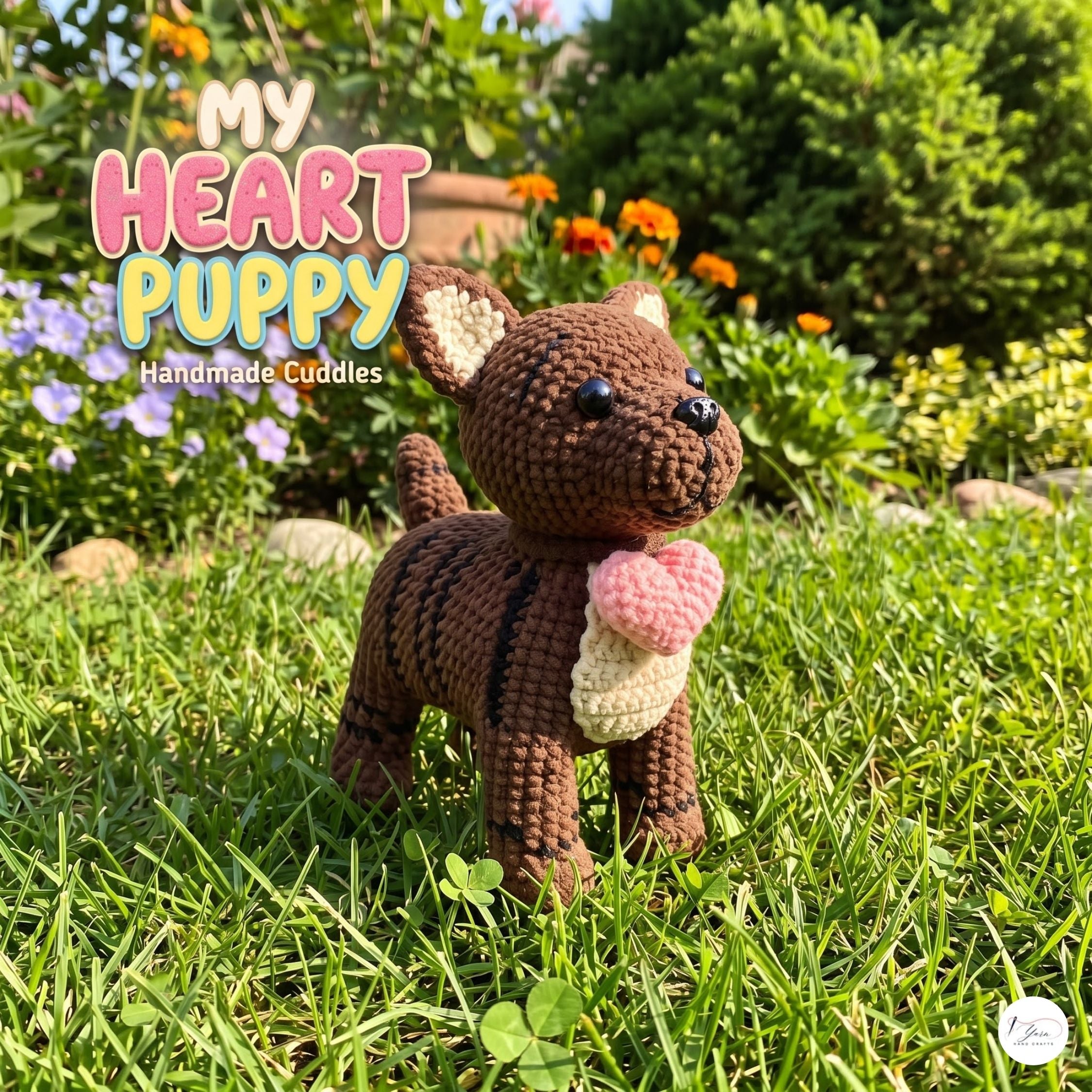 A crocheted puppy doll stands on green grass in a sunny garden, holding a pink heart. Large overlaid text reads 'MY HEART PUPPY Handmade Cuddles.