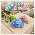 Three handmade crocheted spider toys in green, blue, and pink are arranged on a stone surface outdoors, with decorative text reading 'Cute & Cozy Spider Squad' and 'Handmade Comfort' overlaid at the top.