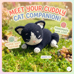 A crocheted black-and-white cat toy lying on grass outdoors, with large promotional text reading 'Meet your cuddly cat companion!' and callout badges noting soft texture, handmade with love, and ages 3+. A small logo appears in the bottom-right corner.