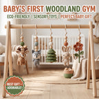 A wooden baby gym with hanging sensory toys in a softly styled nursery. The toy includes a deer, wolf, crocheted tree, bunny, and flower made from wooden beads and crochet fabric.