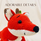 A close-up of a crocheted fox toy with bright red, white, cream, brown, and black details, shown against a soft cream background with the text 'ADORABLE DETAILS' at the top.