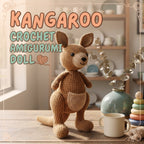 A crocheted kangaroo doll sits on a wooden table in a warm, softly lit room. Large text at the top reads “KANGAROO CROCHET AMIGURUMI DOLL.