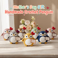 Six handmade crocheted penguin toys in different colors are arranged on a light wooden surface with a blurred floral background. Large decorative text at the top reads 'Mother's Day Gift Handmade Crochet Penguin.