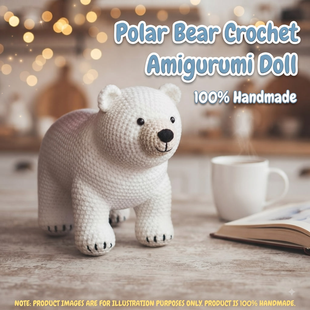 A crocheted polar bear doll standing on a tabletop, with a mug and open book in the background and overlaid text reading 'Polar Bear Crochet Amigurumi Doll' and '100% Handmade'.