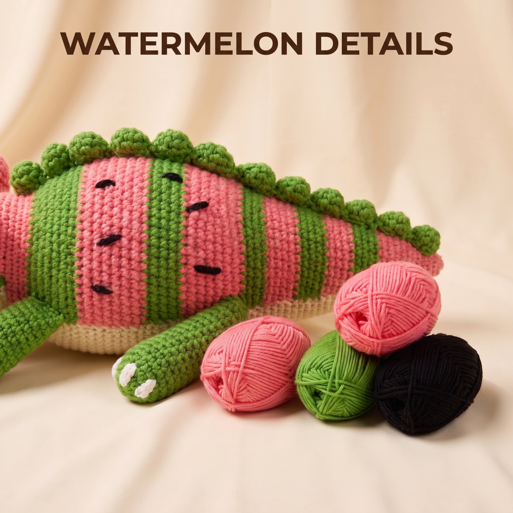 Crocheted watermelon-themed plush toy with pink and green striped body, black embroidered seeds and eyes, shown on a beige fabric background with three balls of yarn in pink, green, and black and the text 'WATERMELON DETAILS' at the top.