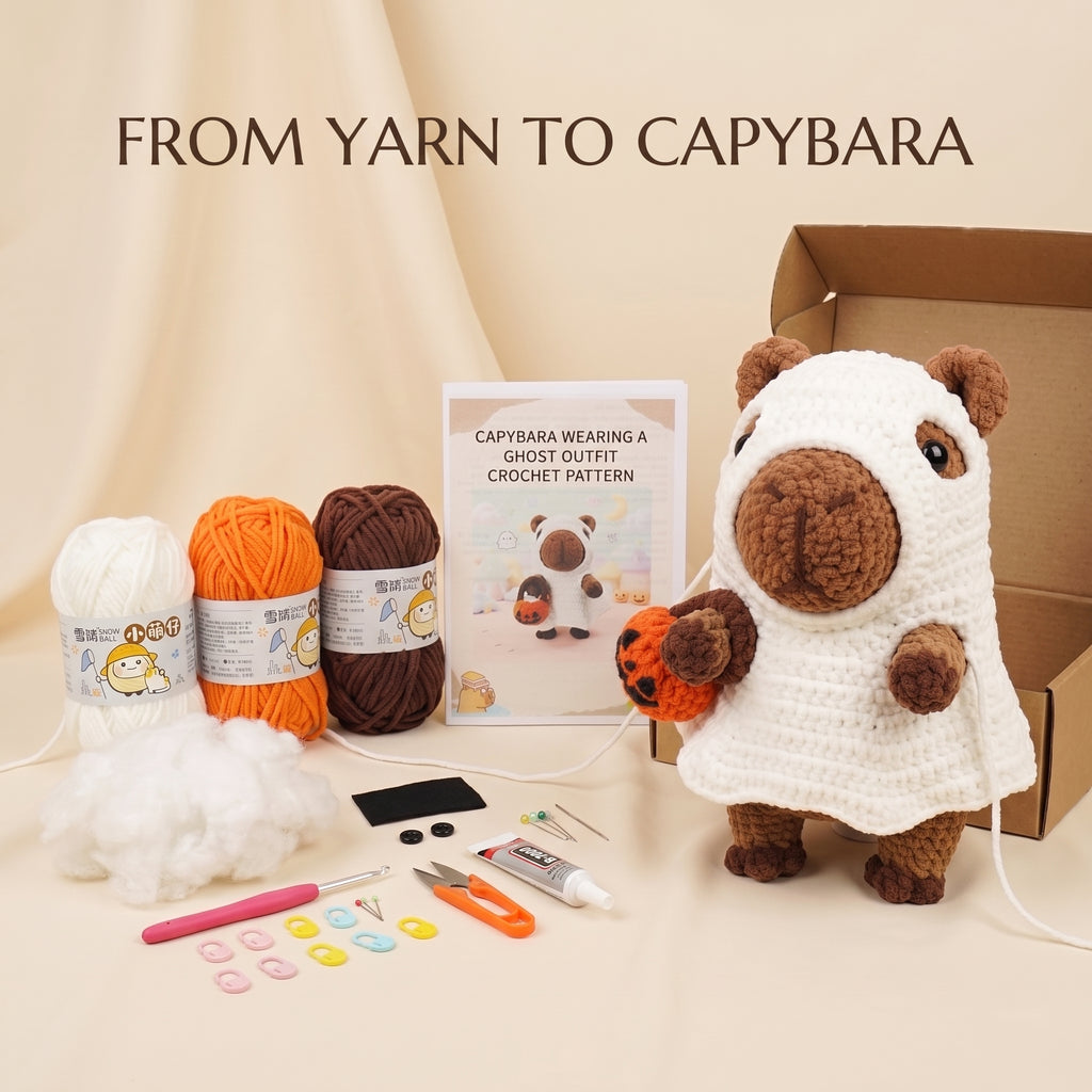 Crochet capybara plush kit with yarn balls in white, orange, and brown, a crochet hook, stuffing, buttons, and a finished white capybara wearing an orange patchwork outfit next to its cardboard box and pattern booklet.