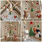 A four-panel collage showing a wooden baby crib mobile with hanging crocheted toys, including a white bear, penguin, fox, reindeer, Christmas tree, ornaments, and pom-pom garlands, displayed inside a crib.
