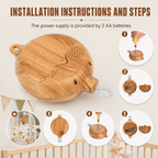 Instructional graphic showing a wooden baby crib alarm clock with a clear hanging loop, alongside step-by-step installation diagrams and text stating it uses 2 AA batteries.