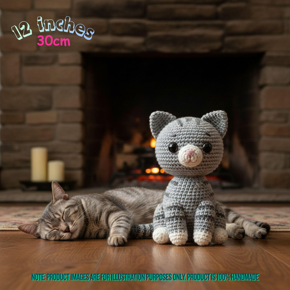 Handmade 12 inches 30cm grey tabby cat crochet amigurumi plush doll sitting next to a real tabby cat in front of a fireplace