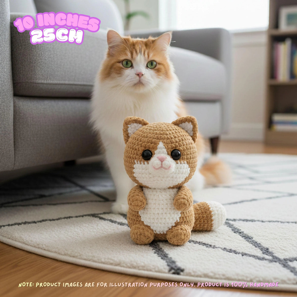 A small crocheted cat toy sits on a patterned rug in front of a real cat in a living room. The toy is tan and white, and the cat behind it is orange and white.