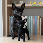 A small black crocheted dog toy stands in front of a real black dog on a tabletop with books in the background. Yellow text in the top right reads '6 INCHES 16cm', and a note at the bottom says product images are for illustration purposes and the product is handmade.