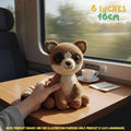 Handmade Ringtail crochet amigurumi plush doll with a striped tail held in a hand on a wooden table, next to a coffee cup by a window in a train car setting, with text indicating 6 inches 16 cm size.