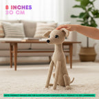 A crocheted dog plush toy in beige is shown in a living room setting with a human hand petting it. The image includes text overlays indicating the size is 8 inches (20 cm) and a note stating the product is 100% handmade.
