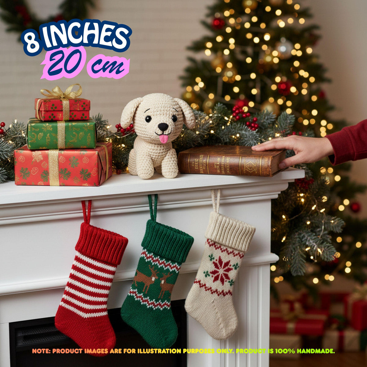 A Christmas-themed lifestyle scene showing a crocheted dog toy on a mantel next to wrapped gifts, stockings, and a lit Christmas tree. A human hand is visible holding a book, and text overlays indicate the product is 8 inches (20 cm) and note that the product image is for illustration purposes only.