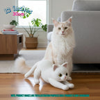 A fluffy cream-colored cat sits on a wooden floor in a bright living room next to a crocheted white cat toy. Text overlays indicate the toy is 12 inches (30 cm) and note it is handmade.