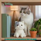 A small crocheted cat toy sits on a wooden shelf beside a real cat in a home interior, with books, a potted plant, and a warm lamp in the background. Text in the image notes the product is 8 inches / 20 cm and says the product image is for illustration purposes only.