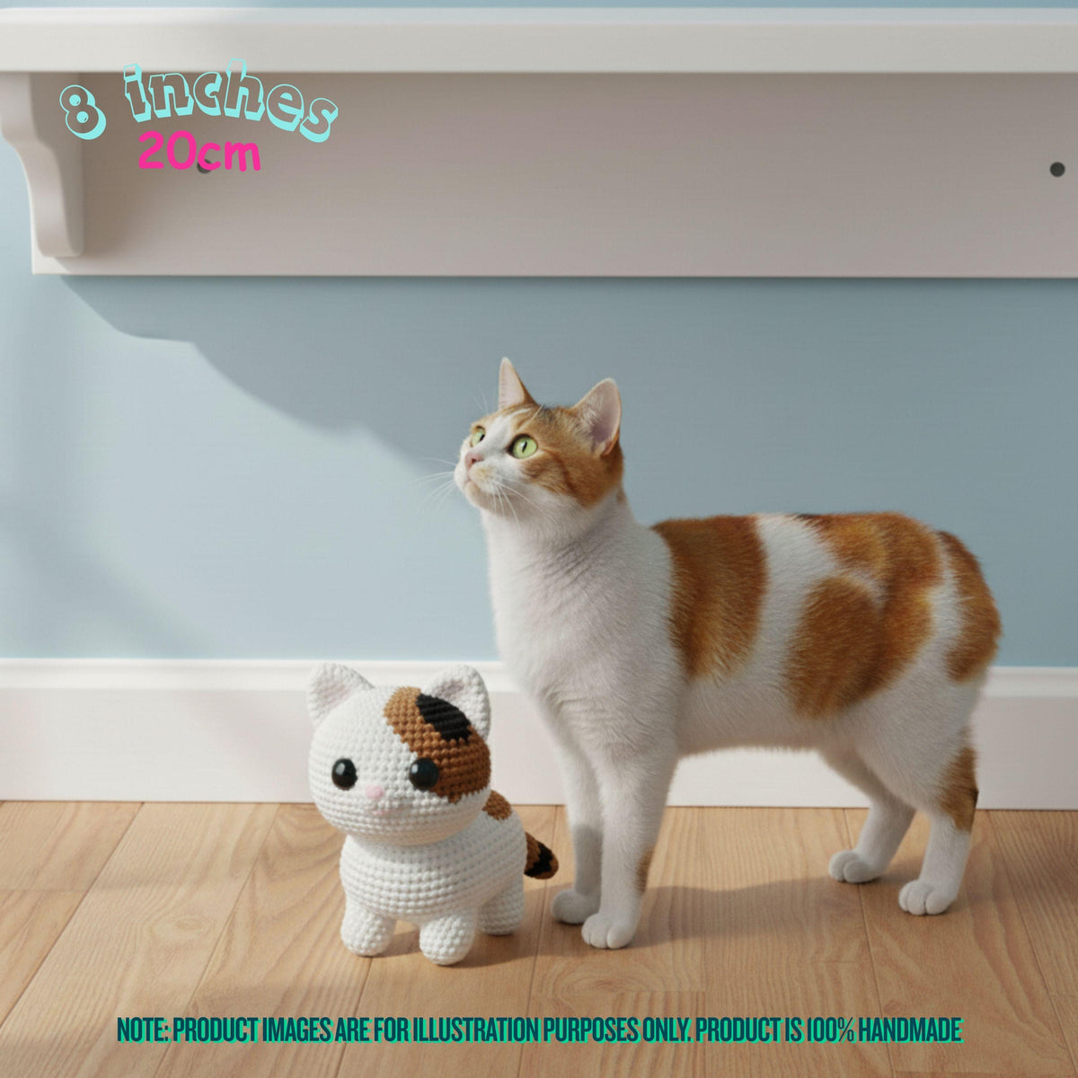 A real cat stands beside a small crocheted cat toy in a home interior with a light blue wall and wood floor. Text in the image indicates the toy is 8 inches (20 cm) and includes a note that product images are for illustration purposes only.