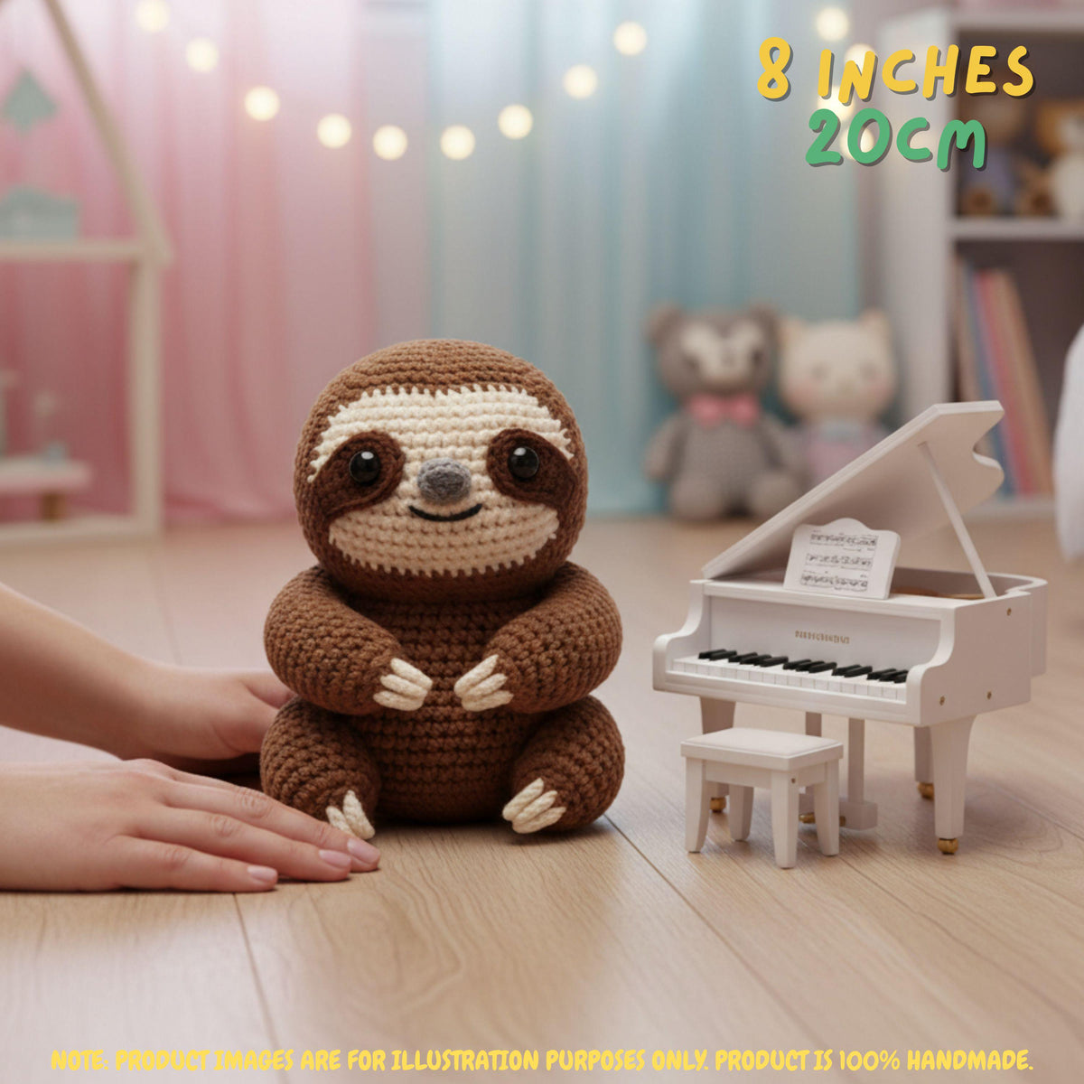 Handmade brown crochet sloth amigurumi doll sitting on the floor next to a white miniature toy piano with "8 INCHES / 20CM" text overlay.