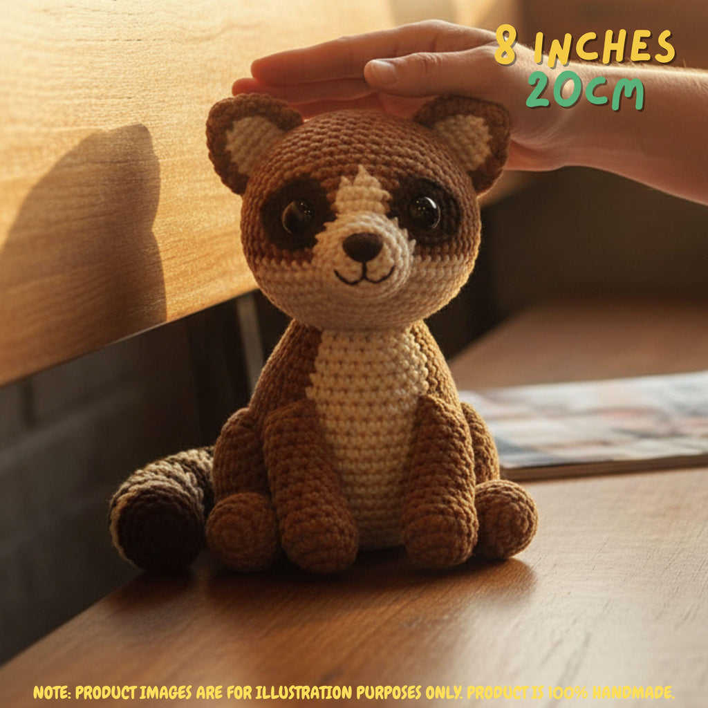 Handmade Ringtail crochet amigurumi plush doll with a striped tail resting on a wooden table, with a hand gently touching its head and text indicating 8 inches 20 cm size.