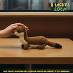 Handmade Stoat crochet amigurumi plush doll in brown and cream with a dark-tipped tail resting on a wooden table, with a hand gently touching its head and text indicating 8 inches 20 cm size.