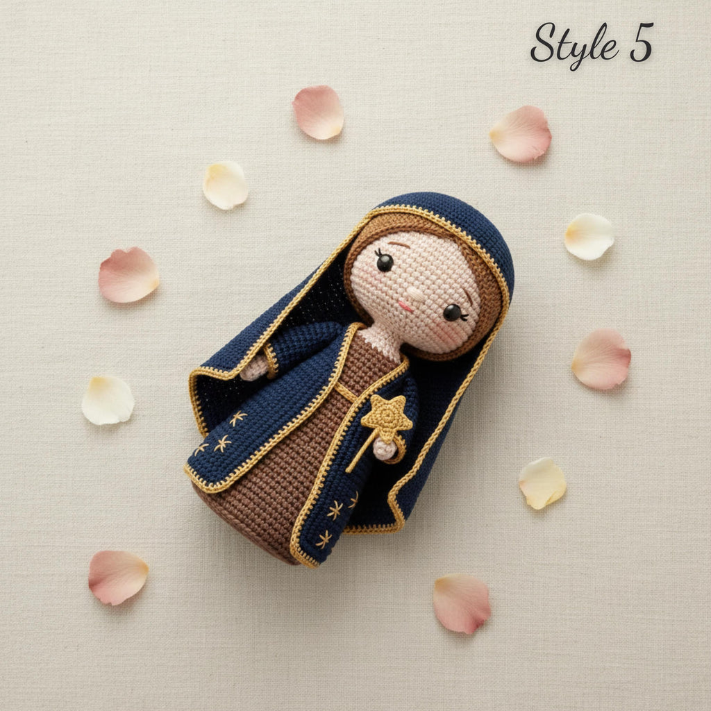 A crocheted doll styled as the Virgin Mary, wearing a navy blue robe with gold trim and a brown dress, lying on a light beige textured background with scattered pink and white flower petals. The text 'Style 5' is visible in the top right corner.