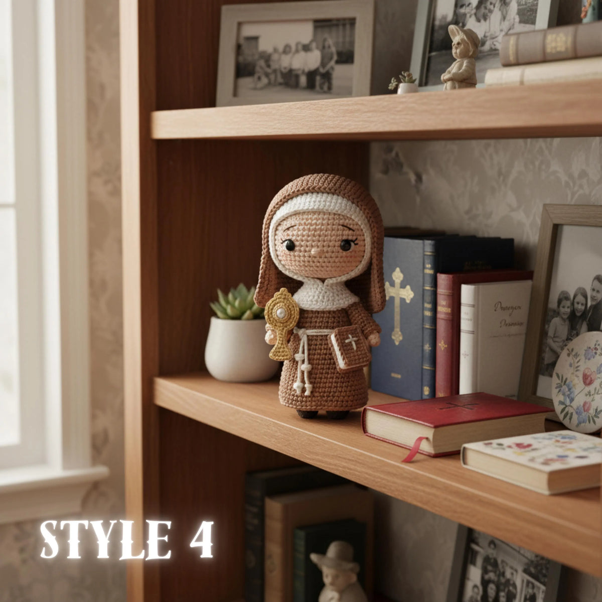 Handmade crochet Saint Anthony amigurumi doll holding Infant Jesus on a wooden shelf display.