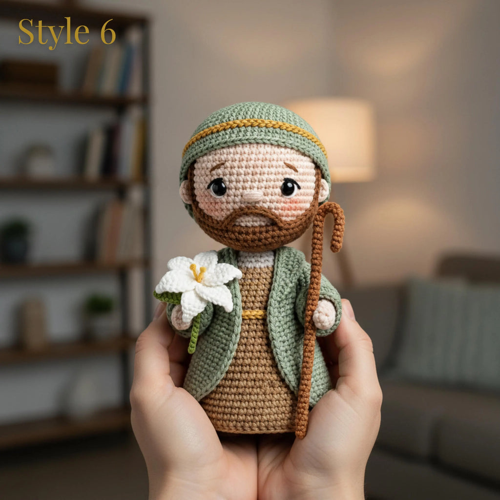 A crocheted doll of a bearded man in a green robe and hat, holding a white flower and a brown staff, is being held in two hands against a softly blurred living room background. The text 'Style 6' is visible in the top left corner.