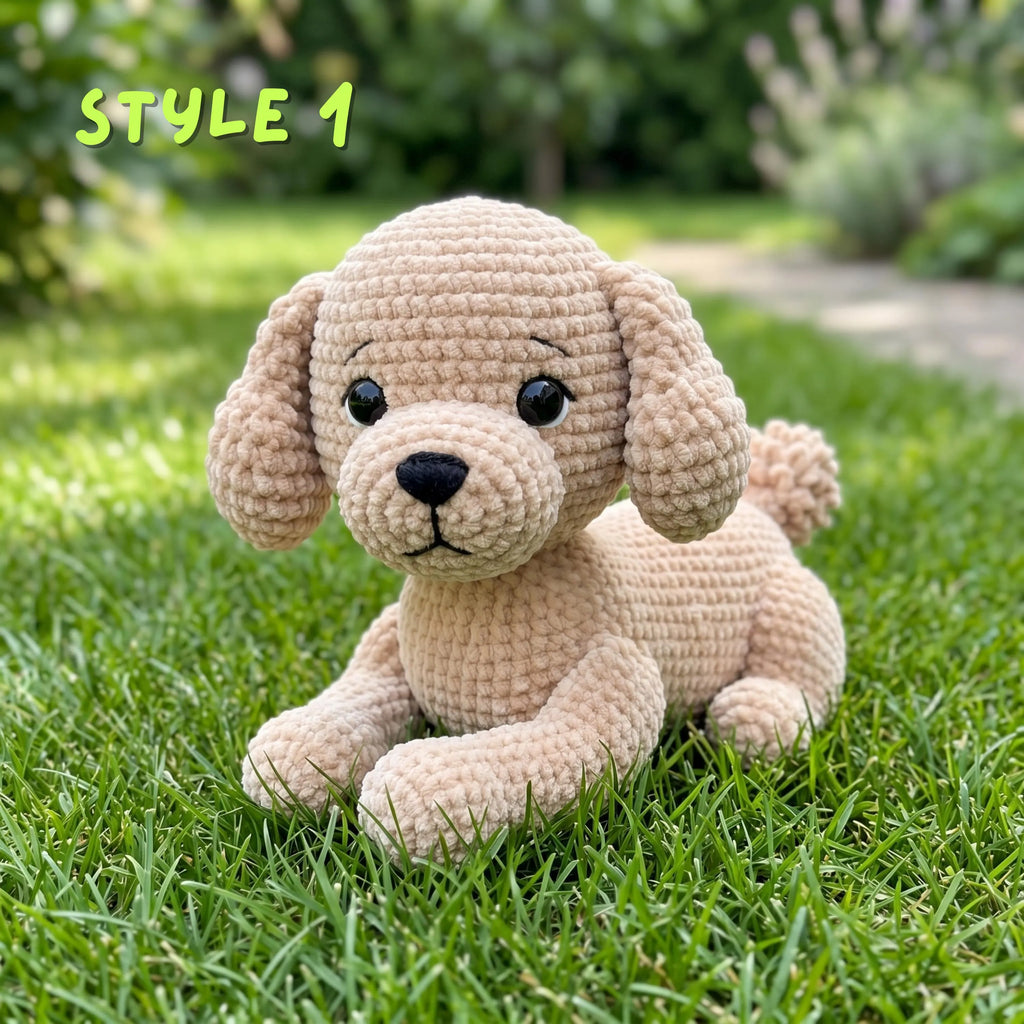 A crocheted plush puppy toy in light beige sits on green grass outdoors, with blurred garden foliage in the background and the text 'STYLE 1' in the upper left corner.