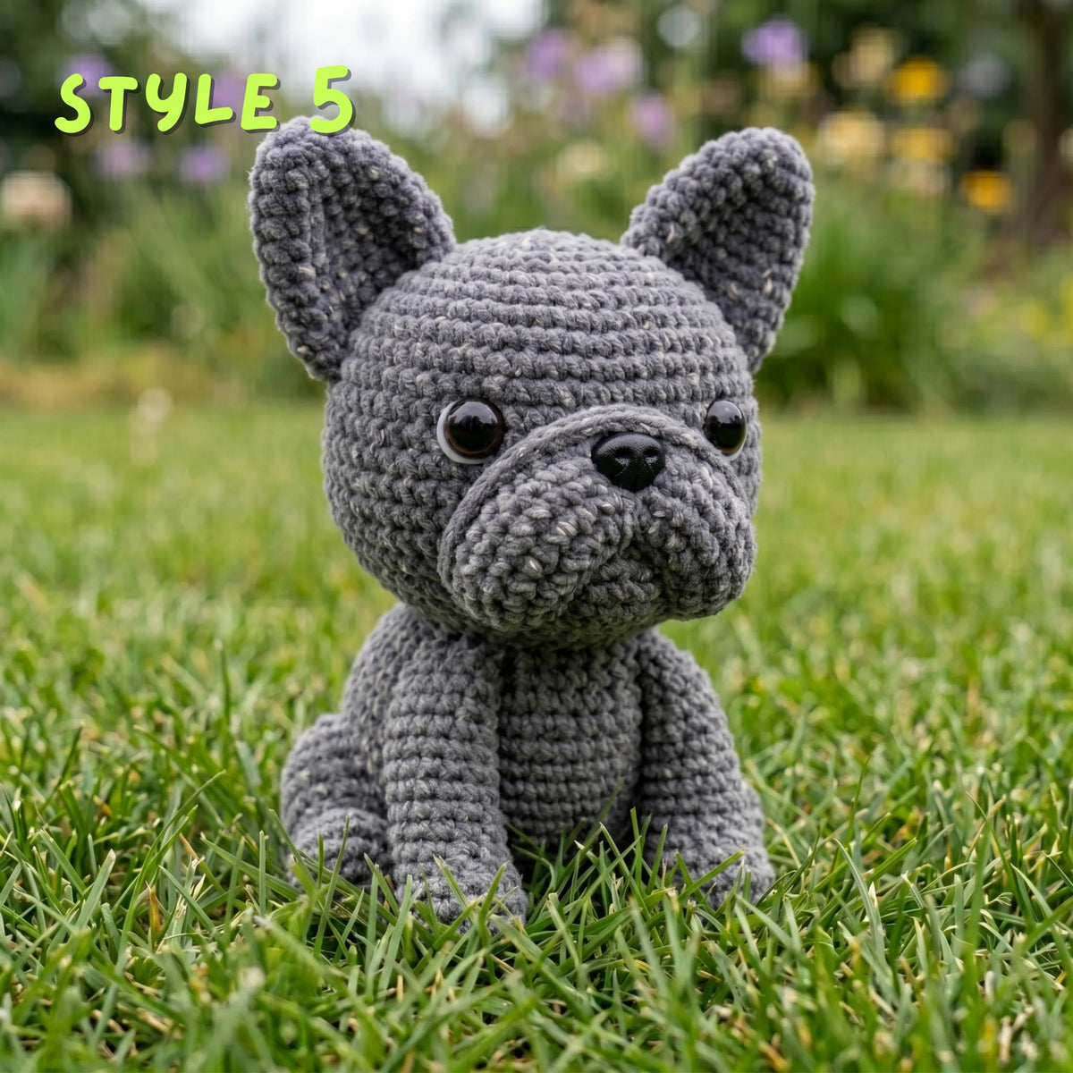 Handmade solid grey crochet French Bulldog amigurumi plushie with "STYLE 5" text overlay sitting on green grass.